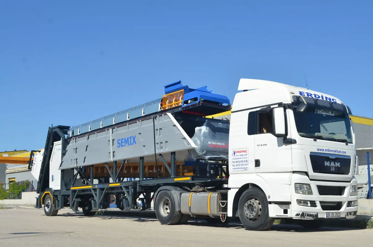AI-generated image of an engineer inspecting a compact, modular concrete batching plant with inline aggregate bins, showing easy access points, sturdy construction, and a clear layout for quick setup in a construction environment.