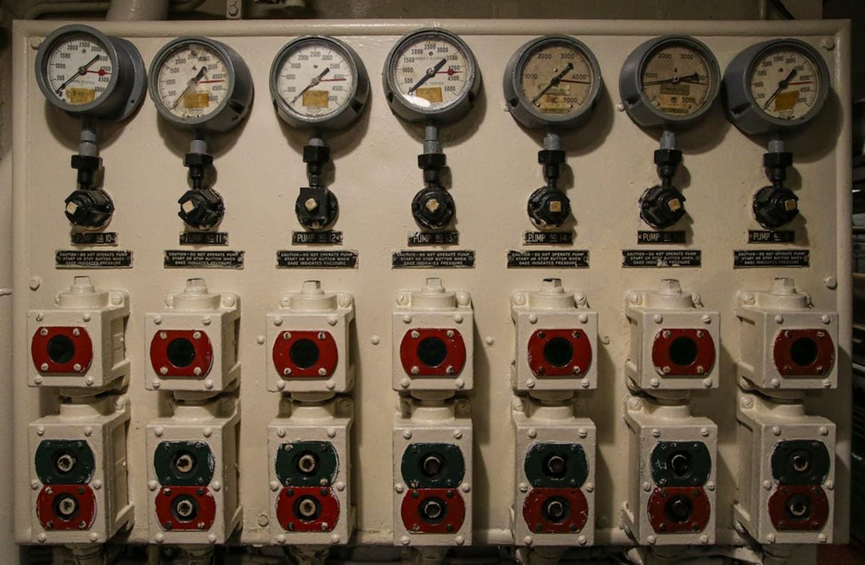 Close-up of an automated control panel of a modern concrete mixing system with digital displays